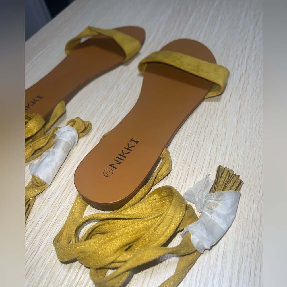 Yellow tie up sandals , suede material